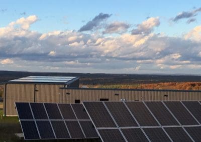 Rooftop and ground mount solar array for Organic climbing company